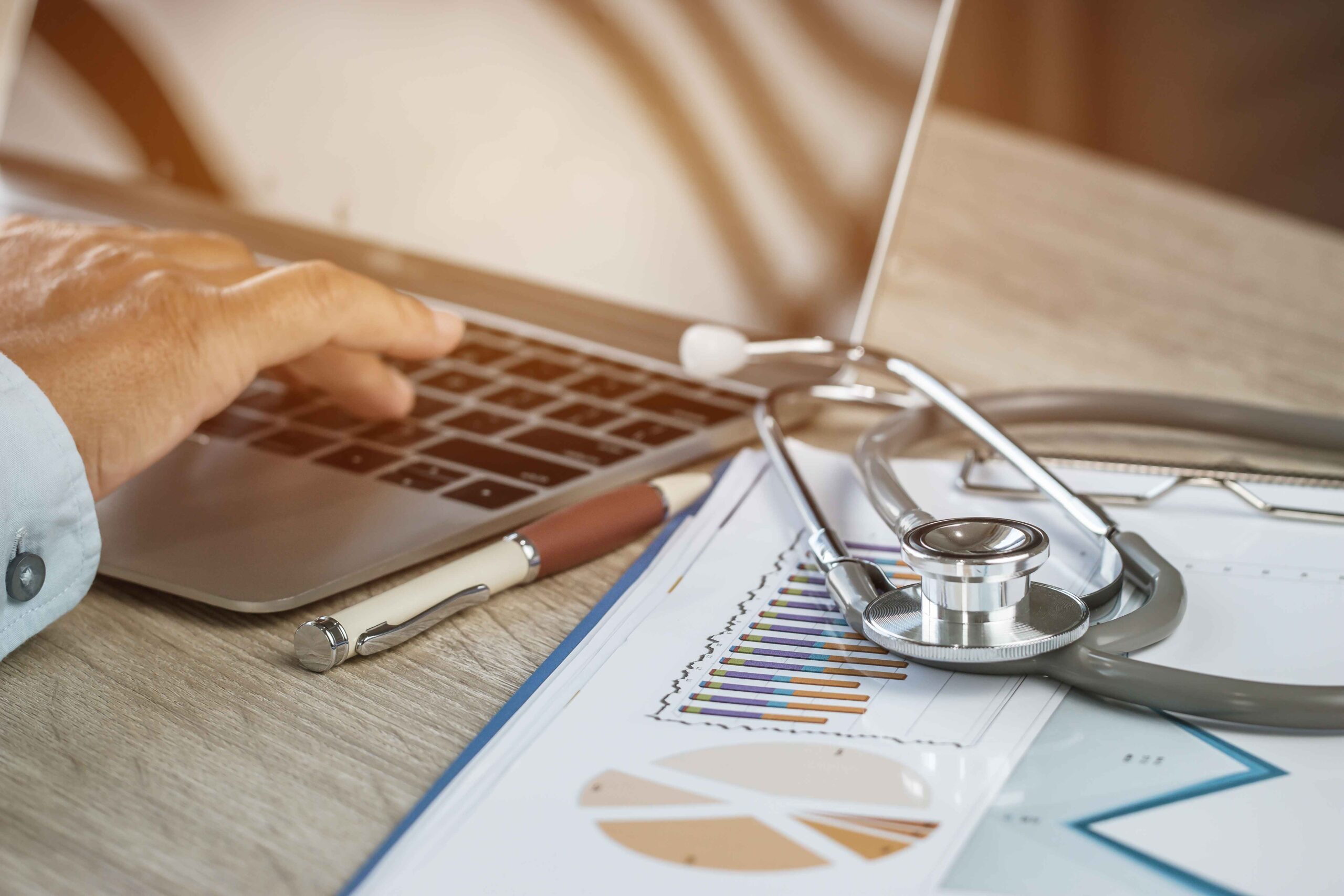 Doctor,Working,In,Hospital,Writing,Prescription,Clipboard,,Working,An,Laptop